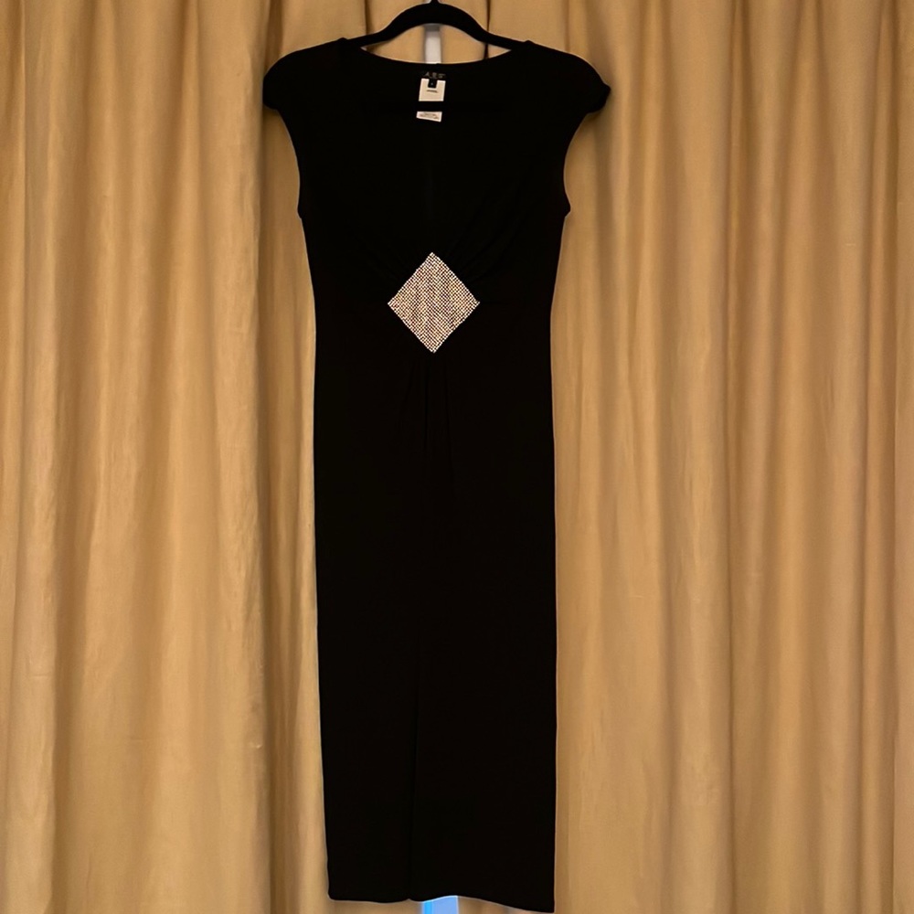 Perfect black cocktail dress with rhinestone detail.
